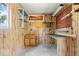 The garage is organized with a workbench and shelving at 10928 W Jackson St, Muncie, IN 47304