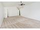 Spacious carpeted bedroom featuring white walls, multiple closets, and natural lighting at 11320 Lynchburg Way, Indianapolis, IN 46229