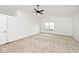 Well-lit bedroom with neutral carpet, white walls, ceiling fan and natural light from window at 11320 Lynchburg Way, Indianapolis, IN 46229