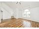 Bright living room boasts wood flooring, a large window and a staircase that leads to the upper level at 11320 Lynchburg Way, Indianapolis, IN 46229