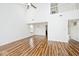 Open-concept living room with high ceilings, sleek hardwood floors, and abundant natural light at 11320 Lynchburg Way, Indianapolis, IN 46229