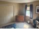 Bedroom featuring a window for natural light, closet doors, neutral colored walls and carpeted floors at 11632 Coastal Way, Indianapolis, IN 46229