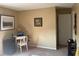 Bedroom features neutral paint, carpet floors, window, desk and blank walls ready for decor at 11632 Coastal Way, Indianapolis, IN 46229