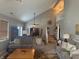 Spacious living room with vaulted ceilings, neutral paint, plush sofas, and stairs to the second floor at 11632 Coastal Way, Indianapolis, IN 46229