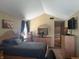 Main bedroom features vaulted ceilings, neutral paint, wood furniture and a view of the staircase at 11632 Coastal Way, Indianapolis, IN 46229