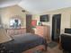 A main bedroom featuring vaulted ceilings, neutral walls, a TV and a comfortable bed at 11632 Coastal Way, Indianapolis, IN 46229