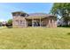 Expansive backyard view featuring a well-maintained lawn and a covered patio perfect for outdoor entertaining at 117 Sawgrass Ct, Lebanon, IN 46052