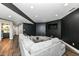Finished basement featuring a comfortable seating area, dark accent wall, recessed lighting, and modern flooring at 117 Sawgrass Ct, Lebanon, IN 46052