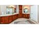 Large bathroom with dual sinks, wooden cabinets, and generous counter space at 117 Sawgrass Ct, Lebanon, IN 46052