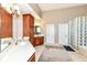 Expansive bathroom with dual vanity, wood cabinets, and glass block shower at 117 Sawgrass Ct, Lebanon, IN 46052