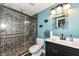 Remodeled bathroom boasts a modern vanity and a glass enclosed shower with striking detail at 117 Sawgrass Ct, Lebanon, IN 46052