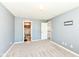Spacious bedroom features soft carpet, a neutral palette, and access to an ensuite bath at 117 Sawgrass Ct, Lebanon, IN 46052