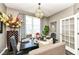 Stylish dining room featuring an ornate table setting, window views, and modern accents at 117 Sawgrass Ct, Lebanon, IN 46052