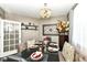 Elegant dining room with a beautifully set table and decorative chandelier at 117 Sawgrass Ct, Lebanon, IN 46052
