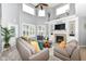 Spacious living room with tall windows, fireplace, and comfortable sectional sofa at 117 Sawgrass Ct, Lebanon, IN 46052