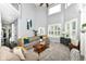 Inviting living room with high ceiling, ample natural light, and comfortable furniture at 117 Sawgrass Ct, Lebanon, IN 46052