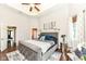 Elegant main bedroom features tray ceilings, recessed lighting, a gray upholstered bed frame, and ample natural light at 117 Sawgrass Ct, Lebanon, IN 46052