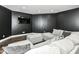 Finished basement recreation room features a gray sectional and stylish decor at 117 Sawgrass Ct, Lebanon, IN 46052