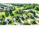 Aerial view of a home in a community with a golf course and a pond at 11961 Driftstone Dr, Fishers, IN 46037