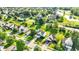 Wide aerial view of a community with lots of mature trees and green grass at 11961 Driftstone Dr, Fishers, IN 46037