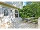 Enclosed back porch with a white wood floor, a door, and lots of shade at 11961 Driftstone Dr, Fishers, IN 46037