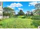 Expansive green lawn with a well-manicured back yard at 11961 Driftstone Dr, Fishers, IN 46037