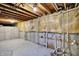 Unfinished basement features insulated walls and exposed utilities at 11961 Driftstone Dr, Fishers, IN 46037