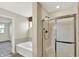 Bathroom featuring separate tub and shower at 11961 Driftstone Dr, Fishers, IN 46037