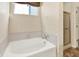 Bathroom offers a tub and separate shower with patterned wallpaper at 11961 Driftstone Dr, Fishers, IN 46037