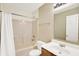 Standard bathroom features a shower-tub combo, vanity, and neutrally painted walls at 11961 Driftstone Dr, Fishers, IN 46037