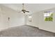 An empty bedroom features two windows and a door to the left at 11961 Driftstone Dr, Fishers, IN 46037