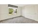 Bedroom featuring neutral carpet, window with blinds, closet with white paneled doors, and white trim at 11961 Driftstone Dr, Fishers, IN 46037