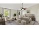Bright bedroom with a ceiling fan, natural light, and comfortable furnishings create a relaxing retreat at 11961 Driftstone Dr, Fishers, IN 46037