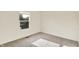 Bright bedroom featuring plush carpet, natural light from the window, and a clean, neutral color scheme at 11961 Driftstone Dr, Fishers, IN 46037