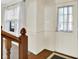 A welcoming foyer featuring wood floors and a stairway at 11961 Driftstone Dr, Fishers, IN 46037