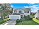 Charming two-story home featuring a well-manicured lawn and an attached two-car garage at 11961 Driftstone Dr, Fishers, IN 46037