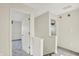An upstairs hallway offers views into the bedroom and a second room at 11961 Driftstone Dr, Fishers, IN 46037