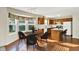 Cozy kitchen and dining area with oak cabinets, modern appliances, and a large bay window at 11961 Driftstone Dr, Fishers, IN 46037