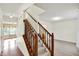 Carpeted staircase featuring wood railing at 11961 Driftstone Dr, Fishers, IN 46037