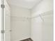 Walk-in closet featuring wire shelving, a neutral carpet, and access through a white door at 11961 Driftstone Dr, Fishers, IN 46037