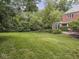 Large grassy backyard with patio area perfect for entertaining at 1207 Pickwick Pl, Indianapolis, IN 46208
