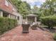 Charming backyard featuring brick patio, gazebo, and lush landscaping at 1207 Pickwick Pl, Indianapolis, IN 46208