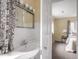 Bright bathroom with a stylish vanity and a view into the bedroom at 1207 Pickwick Pl, Indianapolis, IN 46208