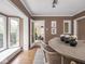 Inviting dining room featuring hardwood floors, natural light, and an open doorway to another living space at 1207 Pickwick Pl, Indianapolis, IN 46208