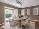 Bright dining room with a bay window, modern decor, and easy access to other living areas at 1207 Pickwick Pl, Indianapolis, IN 46208