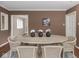Spacious dining area with hardwood floors and neutral walls, easily accessible from nearby rooms at 1207 Pickwick Pl, Indianapolis, IN 46208