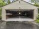 Spacious garage with gray painted floors and ample storage space at 1207 Pickwick Pl, Indianapolis, IN 46208
