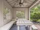 Backyard gazebo with ceiling fan, built in seating and table, with a garden view at 1207 Pickwick Pl, Indianapolis, IN 46208
