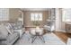 Cozy living room with hardwood floors, stylish furniture, and built-in shelving for a touch of elegance at 1207 Pickwick Pl, Indianapolis, IN 46208
