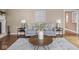 Well-lit living room with stylish furniture, a textured rug, and minimalist decor at 1207 Pickwick Pl, Indianapolis, IN 46208
